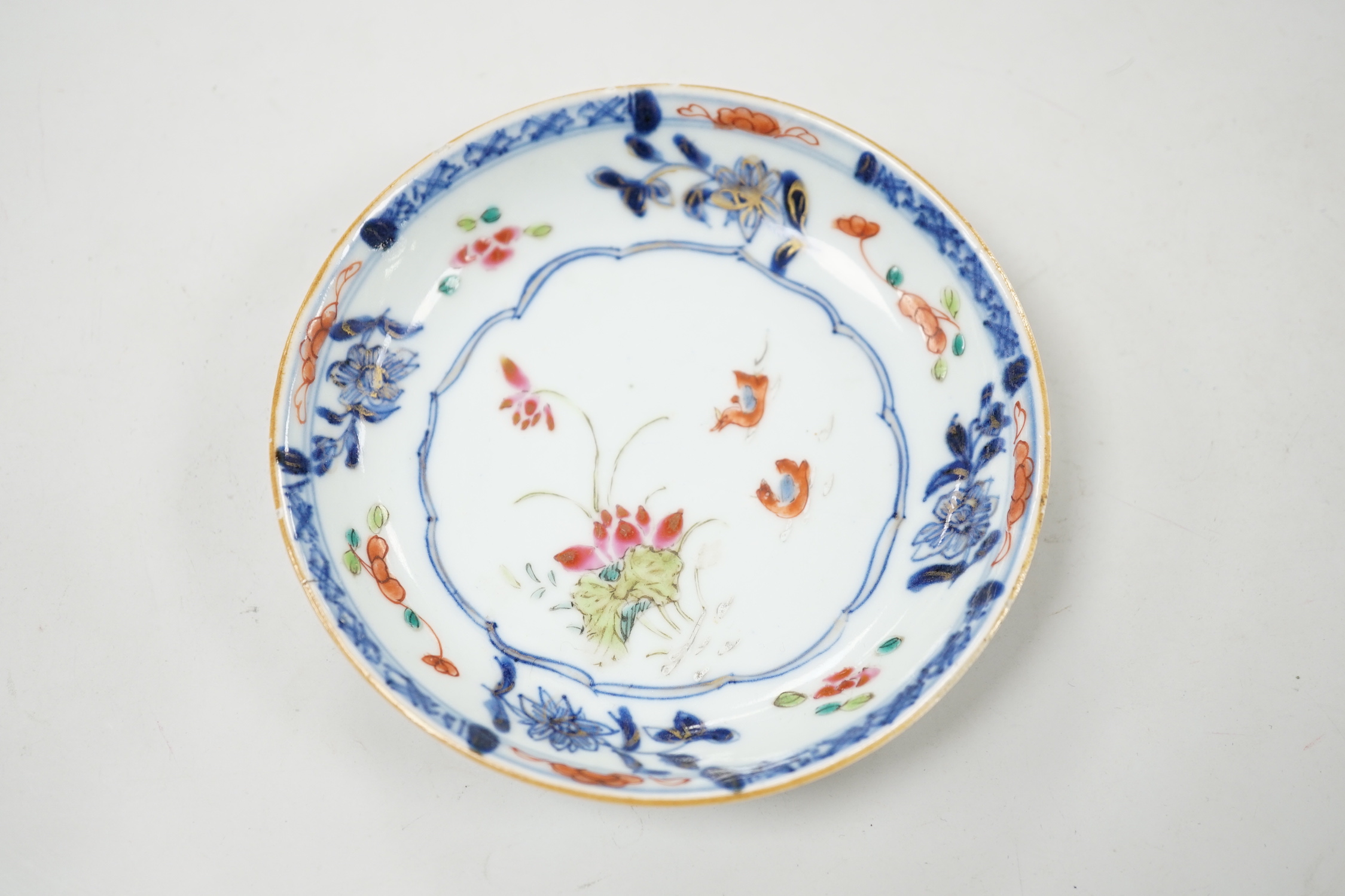 A Chinese famille rose cup and saucer, Qianlong period, saucer 12cm diameter